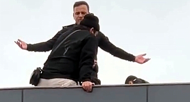 Çatıya çıkan kapıcıyı, başkomiser ikna etti